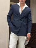 Man wearing a classic striped double breasted blazer in regular fit