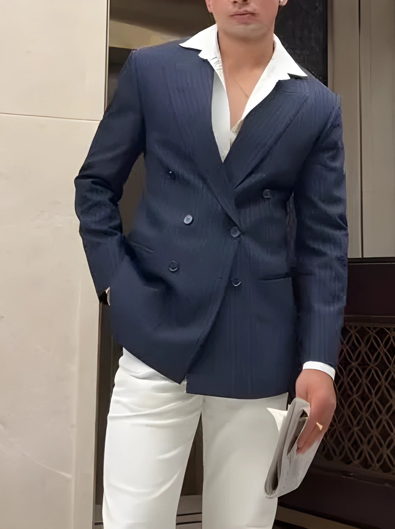 Man wearing a classic striped double breasted blazer in regular fit