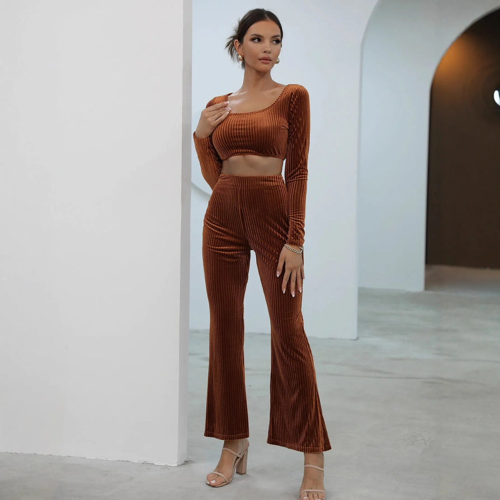Caramel coloured long sleeve sweater and straight-leg trousers set on a hanger