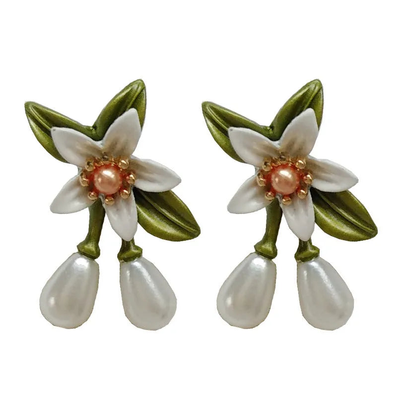Women's alloy flower earrings showing camellia stud and ear clip options with personality contrast colour