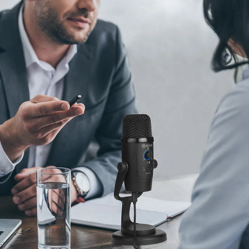 Black Boya BY-PM500 USB microphone with built-in sound card on a desk