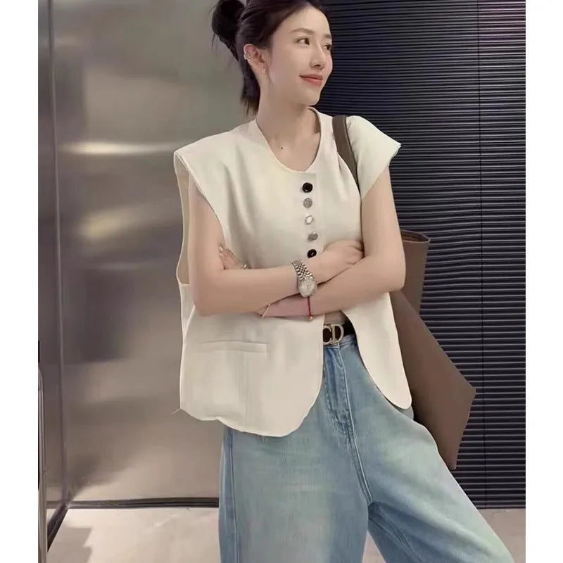 Women's loose fit vest with 40cm short length in milky white colour showing pocket detail