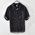 Men's loose fit black lapel polo shirt on a hanger, short sleeves, casual style.