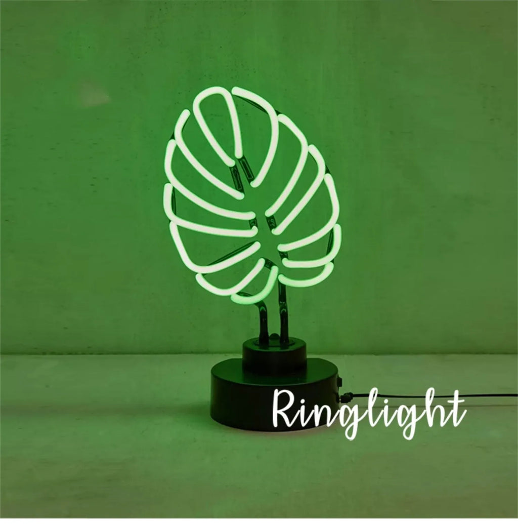 Minimalist green light bamboo desk lamp with USB plug on a wooden table.