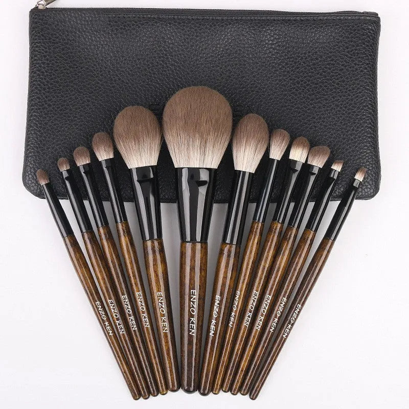 12-piece makeup brush set with wooden handles in a grey PU zip case