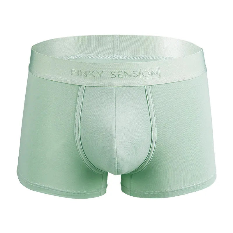 Men's solid colour cotton boxer shorts in black, shown in a loose fit style.