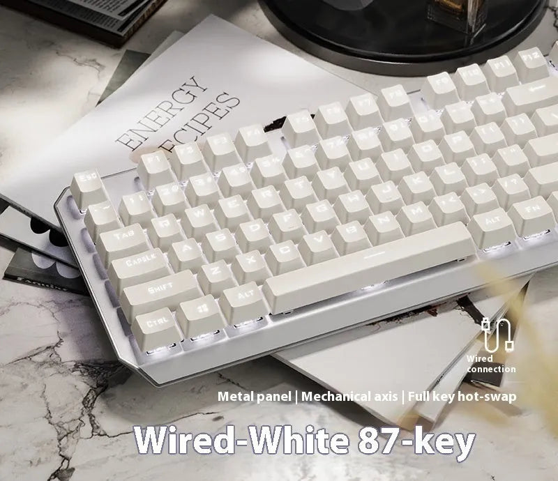 87-key wired mechanical keyboard with side-engraved keycaps, silver white finish, compact layout