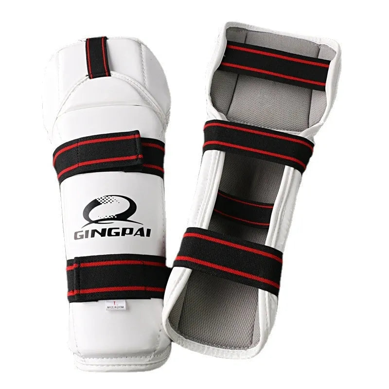 Taekwondo arm guards and leg protectors set in black PU EVA foam on a white background.