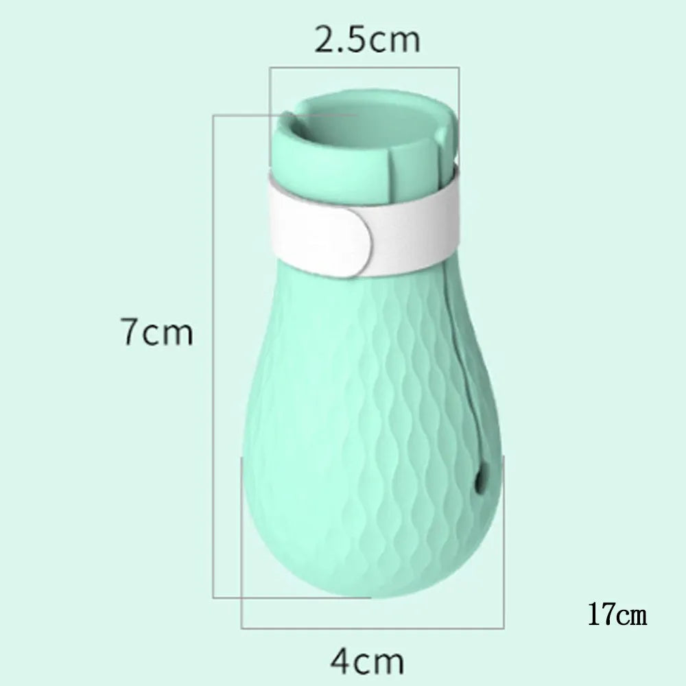 Set of four green silicone cat anti-scratch foot covers or gloves for pet care.