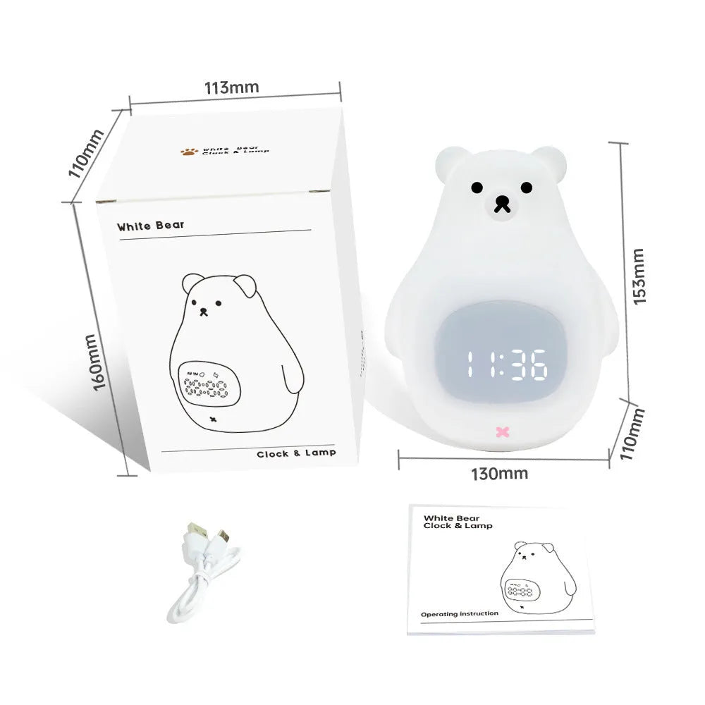 White silicone bear-shaped night light with remote control on a bedside table.