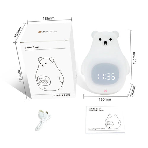 White silicone bear-shaped night light with remote control on a bedside table.