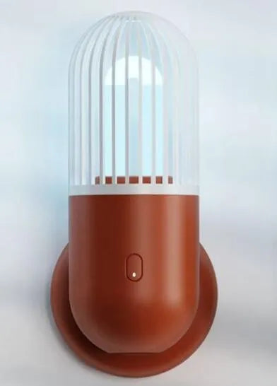 Portable capsule UVC disinfection lamp in four colours with dimensions 64x64x148mm
