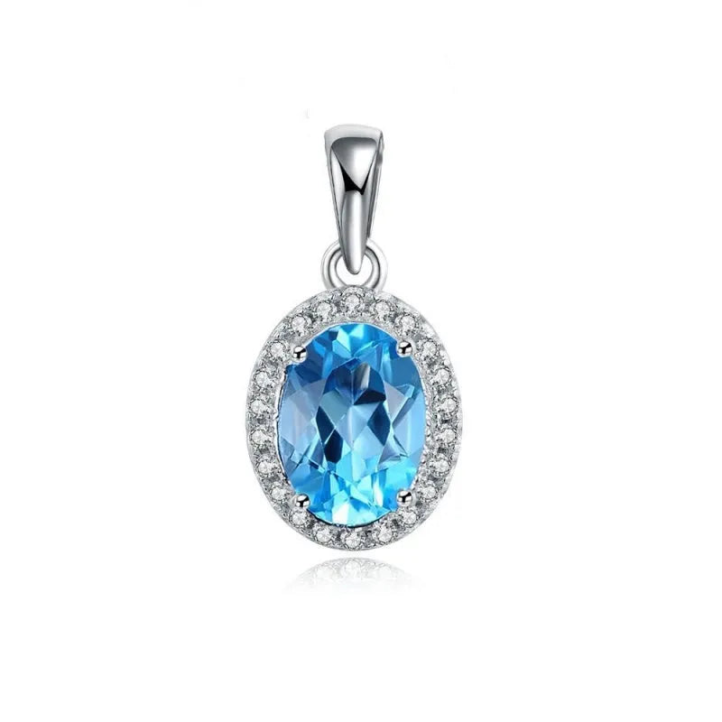 925 sterling silver blue topaz geometric jewellery set showing necklace, earrings, ring, and pendant