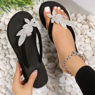 Women's cloth upper slippers in white, brown, or black with rubber and plastic sole, sizes 36 to 42