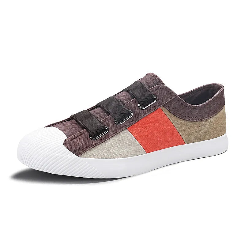 Men's canvas sneakers with rubber sole in multiple colour options showing low top design and elastic band