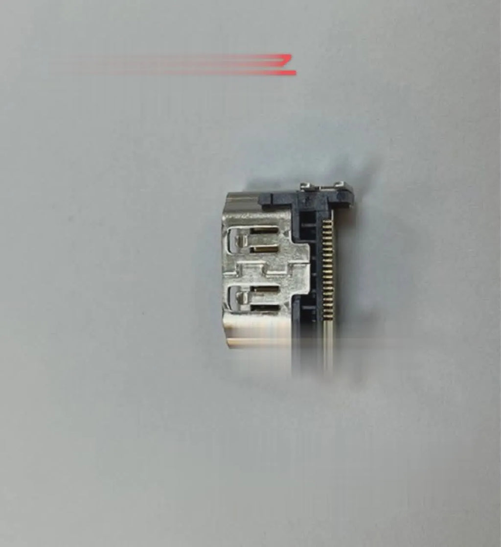 Silver coloured HDMI host socket interface for gaming console accessory.