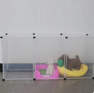 Pet transparent fence with six clear plastic panels arranged as a barrier on a wooden floor, showing interlocking connectors