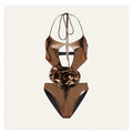 Gold handmade halter neck one-piece swimsuit with hollow-out detailing on a mannequin.