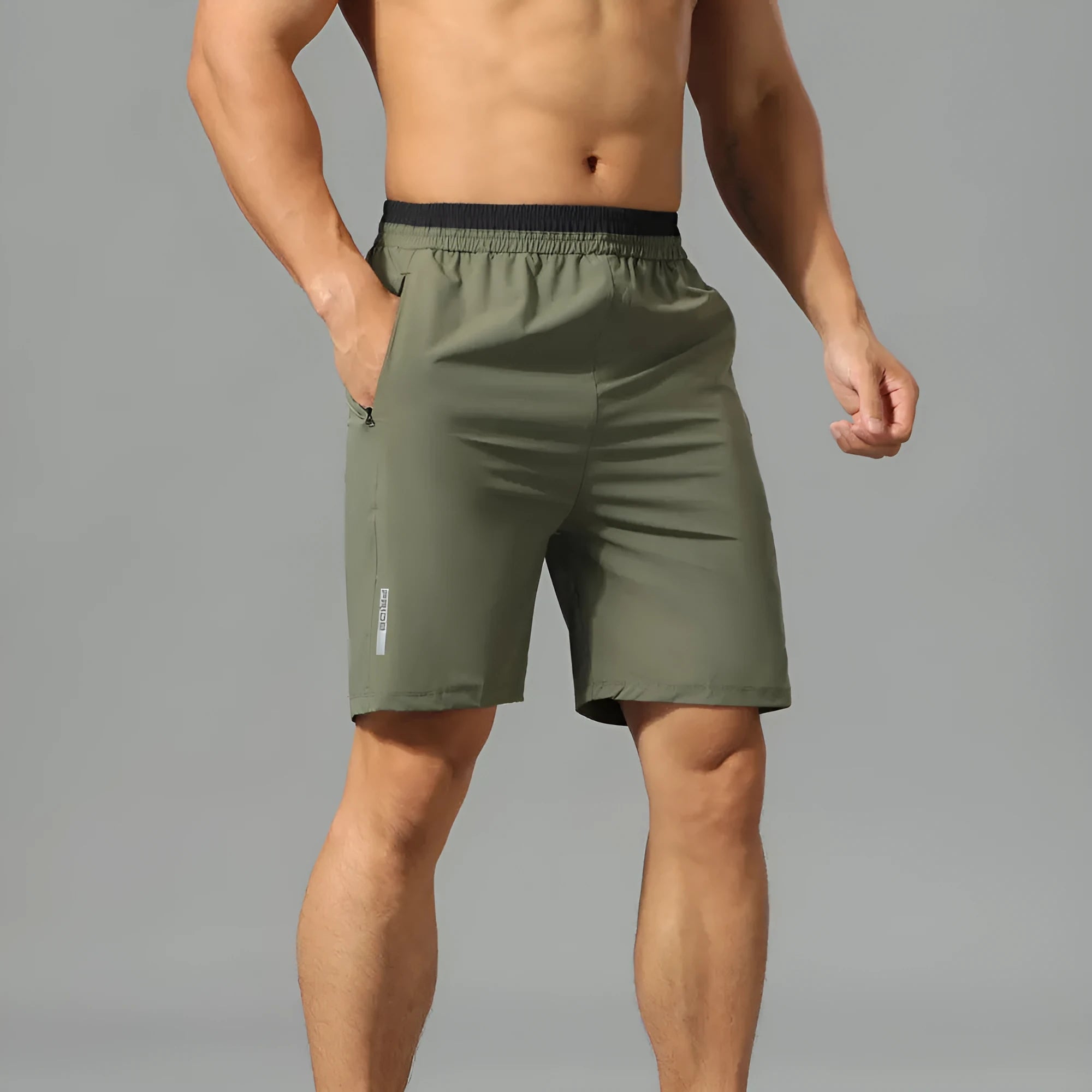 Men's loose ice silk cropped running pants in Army Green, shown in a relaxed fit for sports.