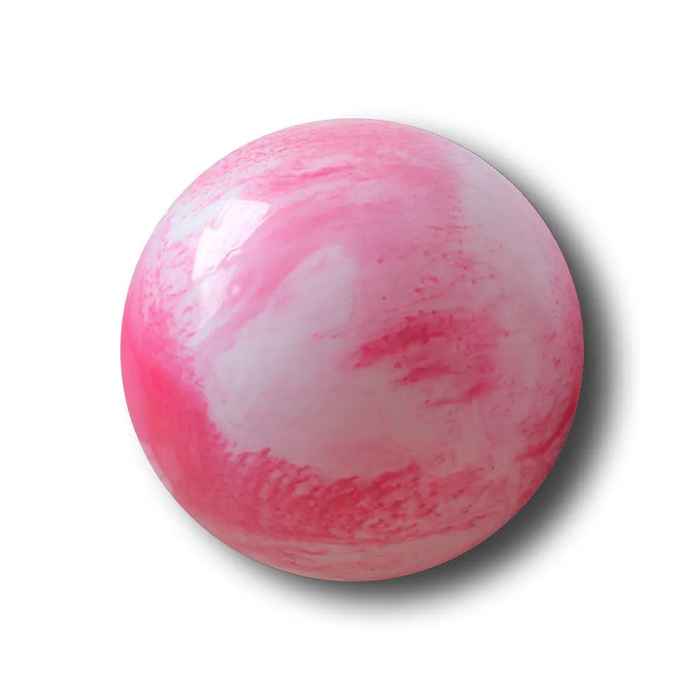 Colourful polyvinyl chloride yoga ball on floor for pilates and stretching exercises