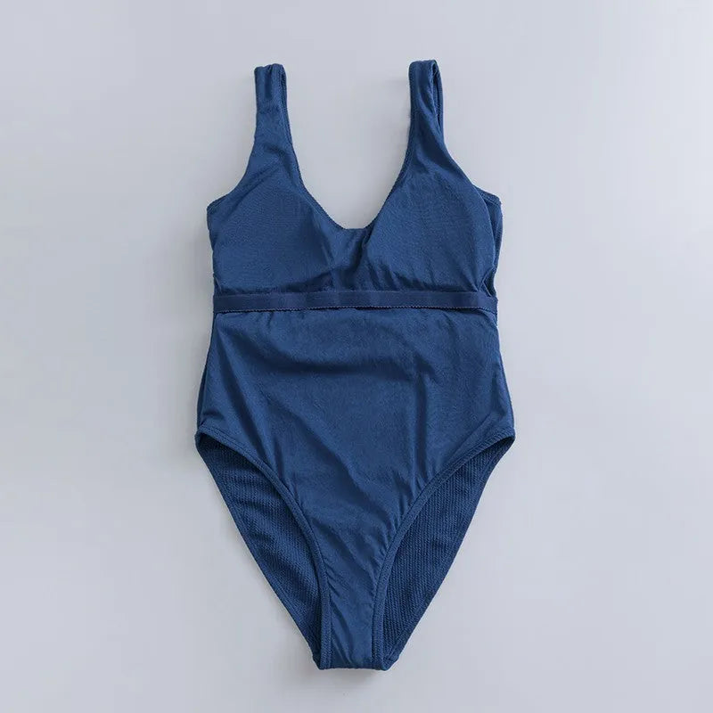 Navy blue women's one-piece slimming swimsuit with triangle neckline and chest pad.