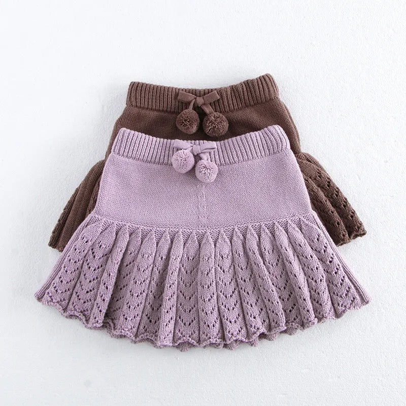 Girls hollow retro pleated pantskirt in light gray purple cotton, front view, on child of about 90cm height