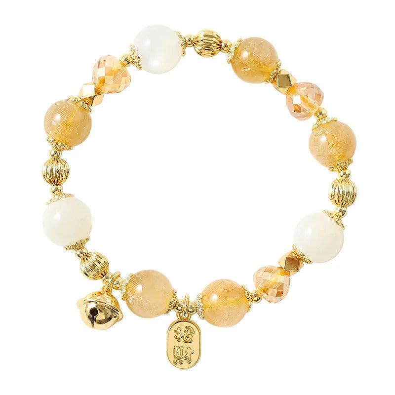 Gold electroplated bracelet featuring natural rutilated quartz crystals with golden rutile needle inclusions