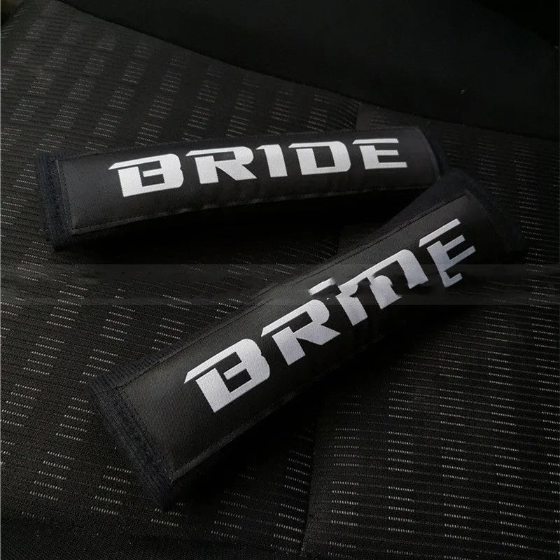 Car seat belt shoulder pads in black, blue and red options with cotton sponge cloth construction