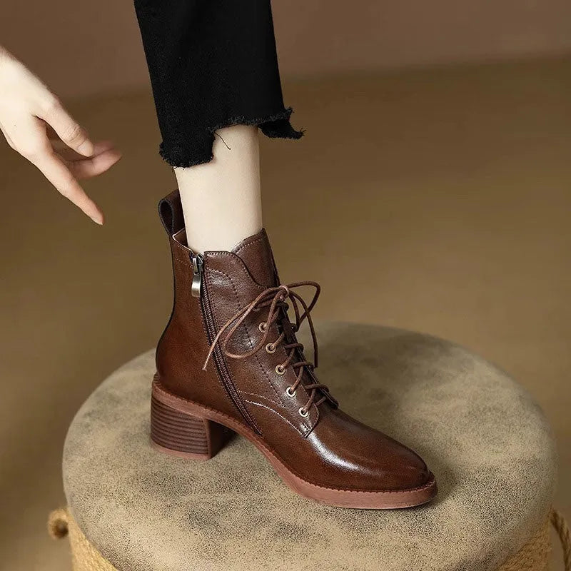 Women's black pointed-toe short boots with a 5.5cm heel and velvet finish on a neutral background.