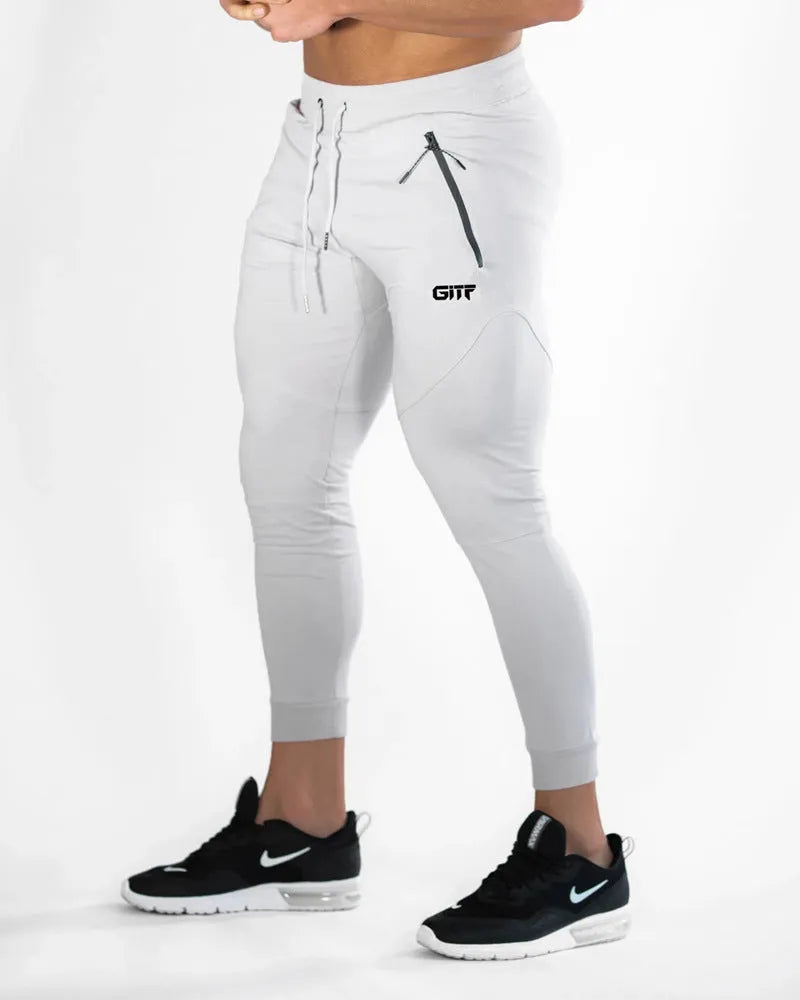 Men's camouflage quick dry jogging trousers in slim fit style from front view on plain background