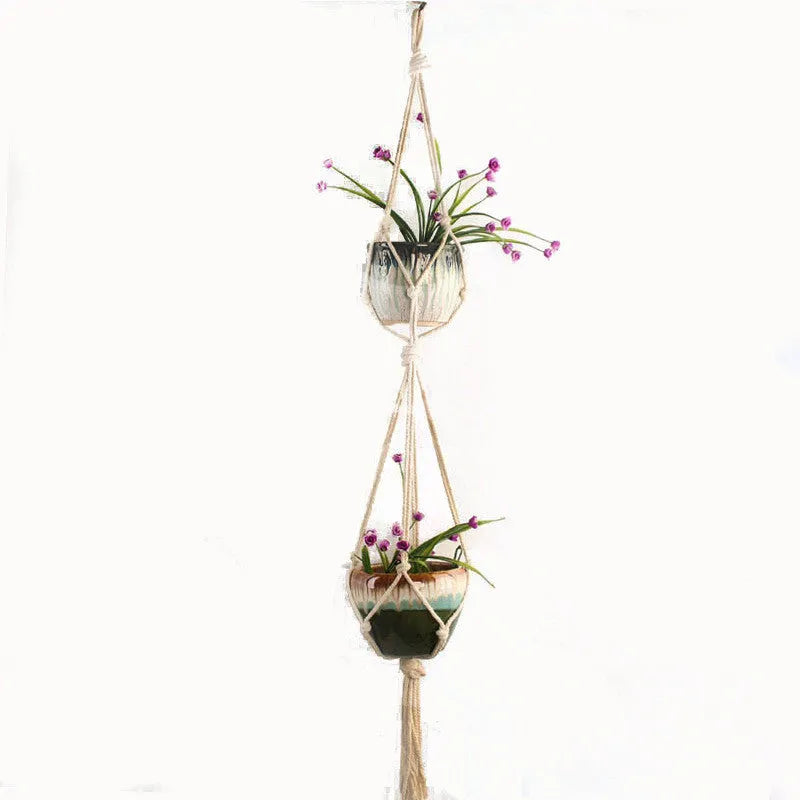 A rustic-style woven cotton rope plant trellis panel supporting green leaves.