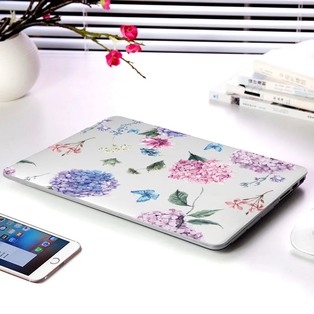 Plastic laptop protective shell with a floral pattern design for MacBook Air and MacBook Pro models.