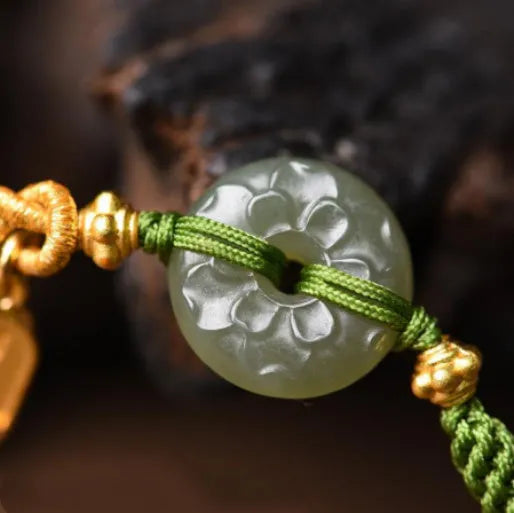 Green rope bracelet with Hetian jade peace buckle fastener, traditional Chinese hand-woven construction