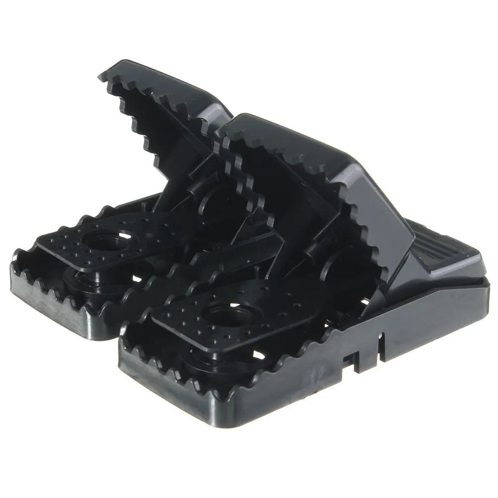 Six black plastic snapping mousetraps with dimensions 11cm long by 5cm wide