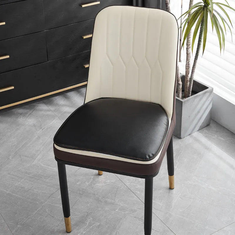 Leather horseshoe-shaped seat cushion in beige colour showing thickness and shape