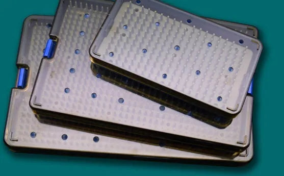Silicone UV disinfection box for mobile phones in three different sizes on a table.