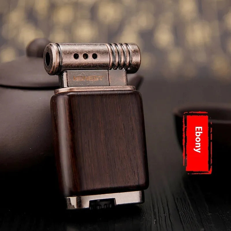 A decorative gas lighter with a carved wooden handle combining black wood, rosewood symbols, and a red wood tube accent.