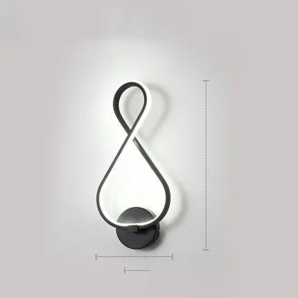 Nordic minimalist LED wall lamp with silicone shade in black finish on a white wall.