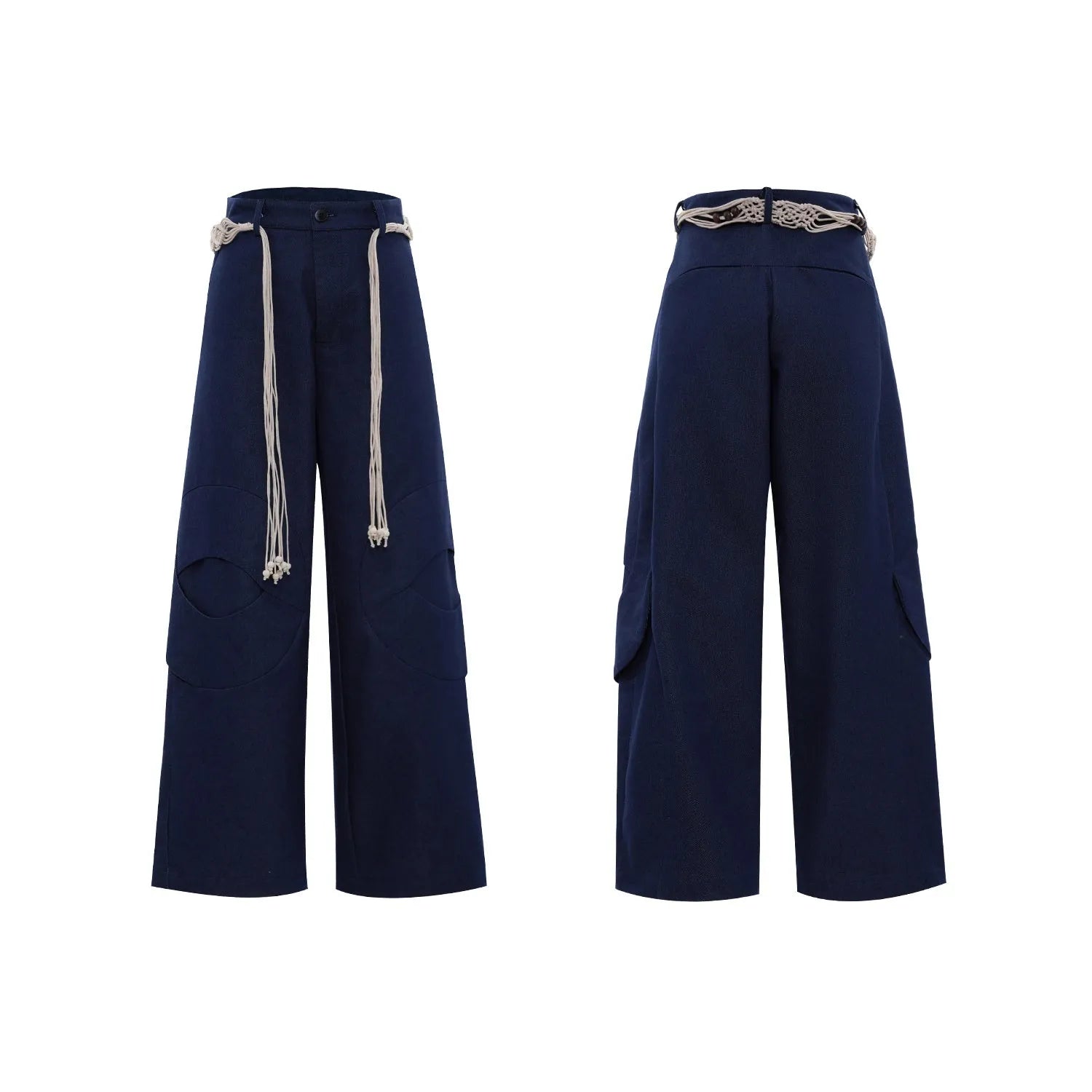 Man wearing dark blue cotton straight-leg trousers with heavy 3D belt stitching and decorative tassel details.