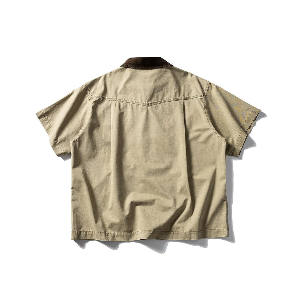 Loose fit grey washed denim short sleeve shirt overalls on a hanger