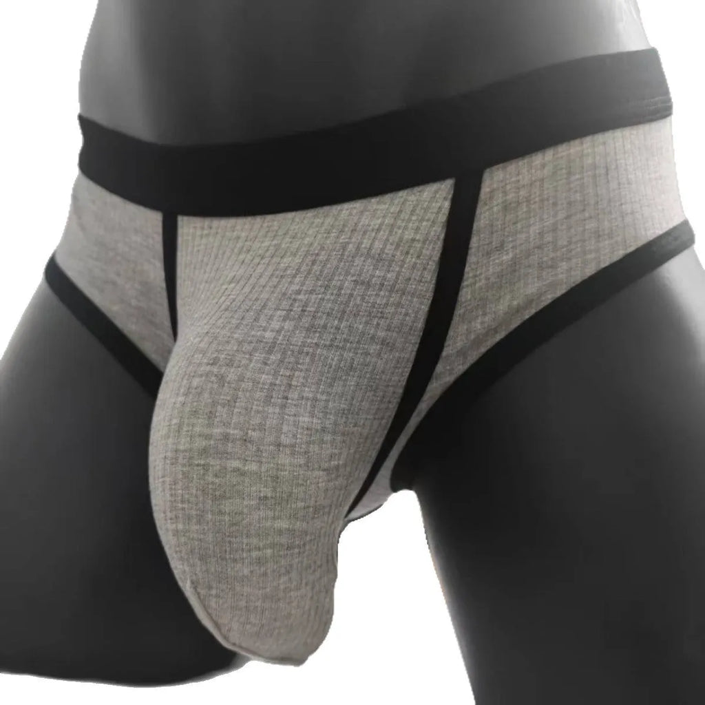 Men's solid colour U-shaped briefs in viscose fabric on a size chart background.