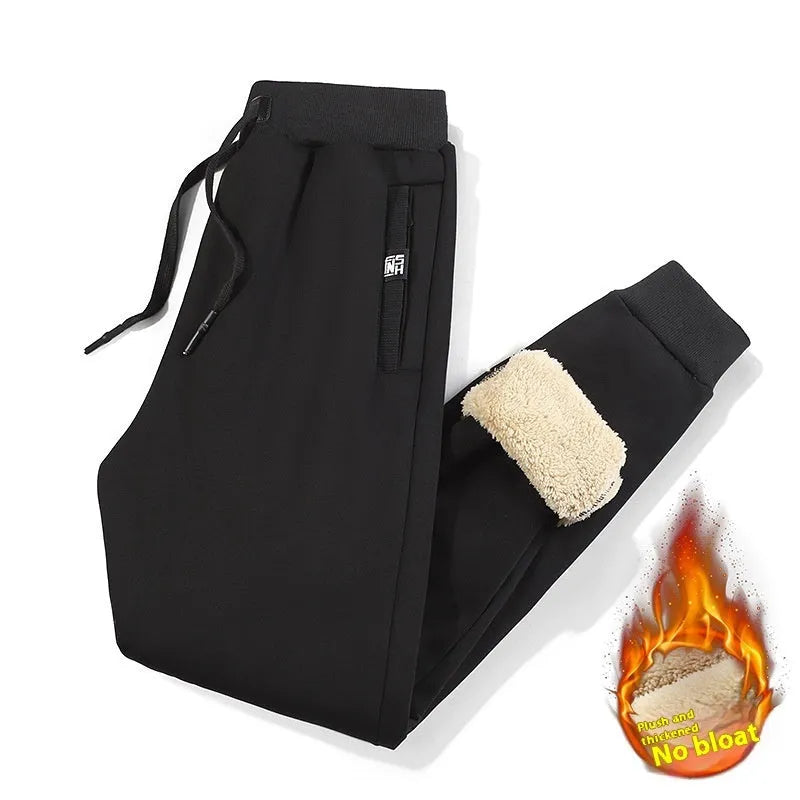 Men's grey fleece-lined oversized track pants with elastic waistband
