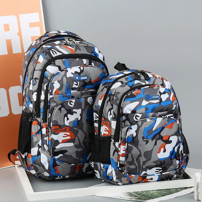 Blue Oxford fabric school backpack with padded black shoulder straps and side pockets.