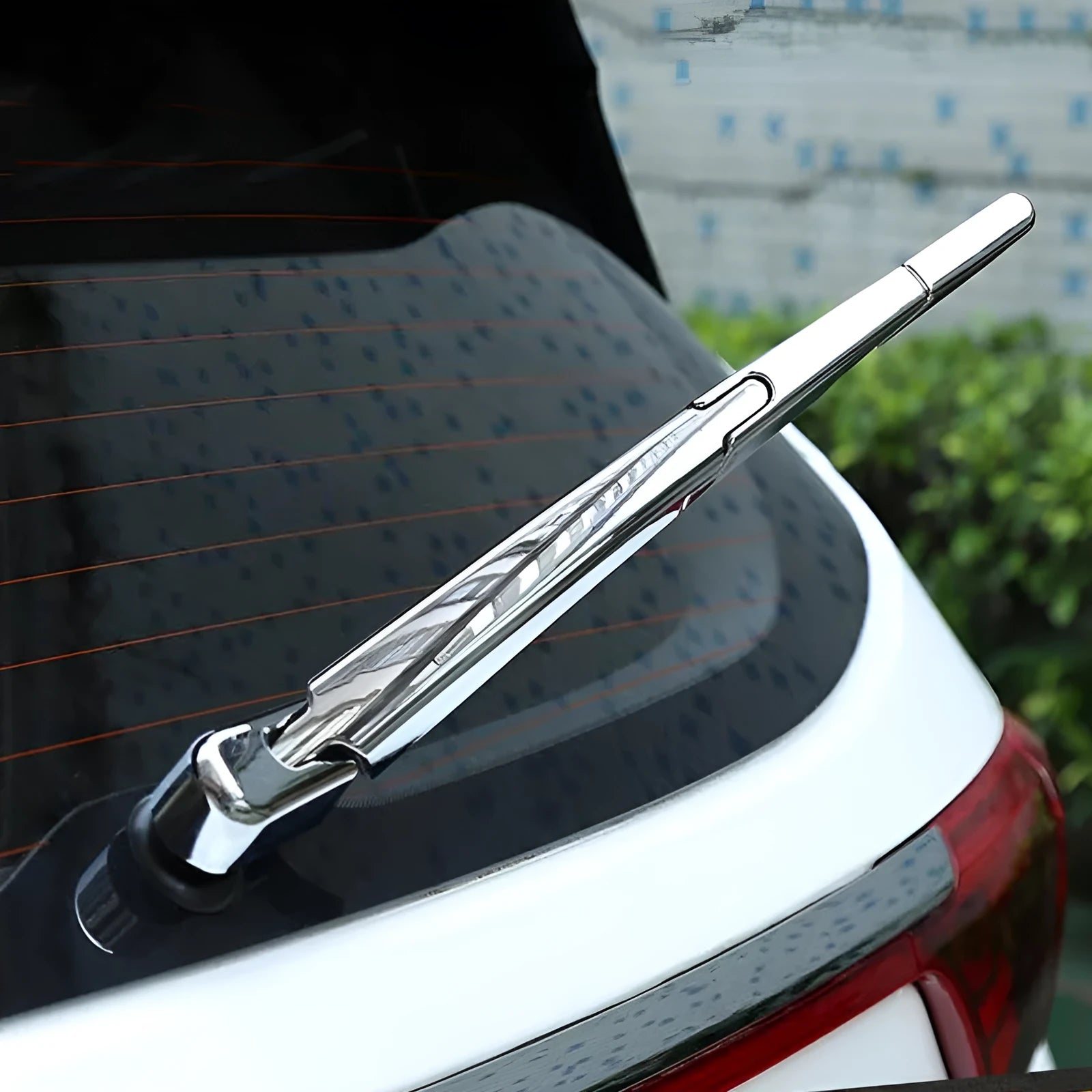 Set of four silvery ABS plastic rear window wiper cover trims for 2010 Hyundai models.