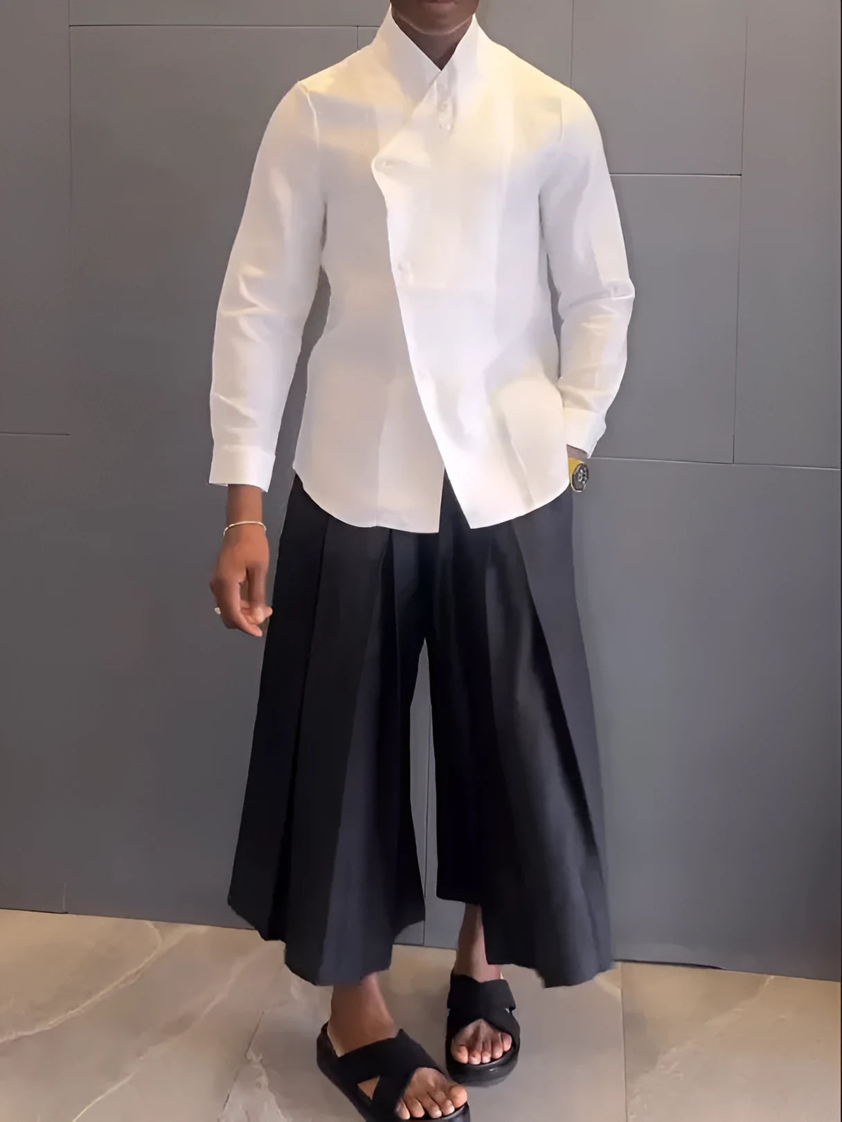 Women's white asymmetrical front long sleeve shirt with black pleated trousers casual set