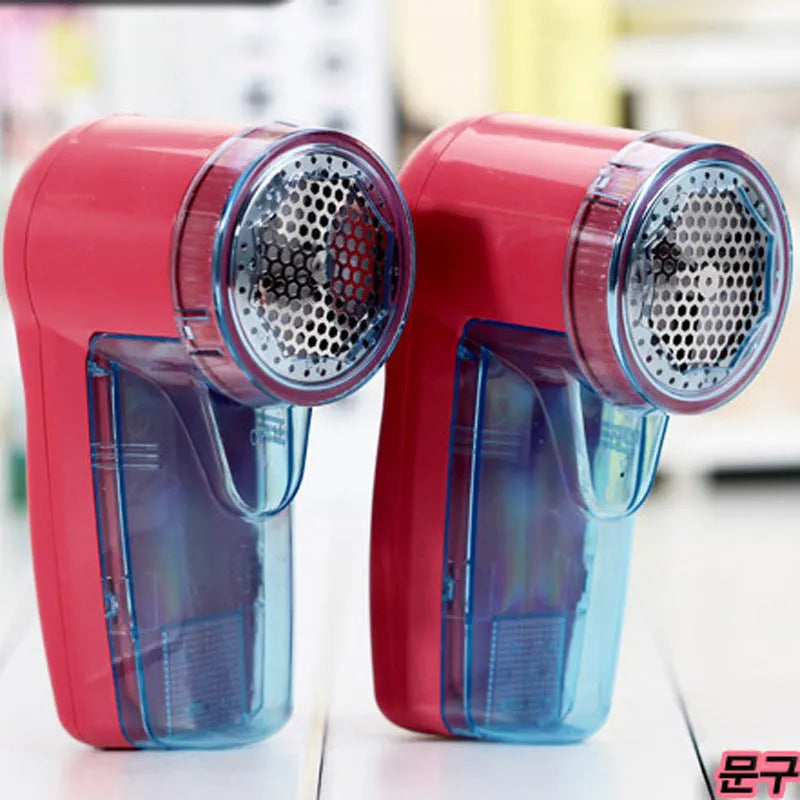 Blue portable electric lint remover for clothing on a white background.