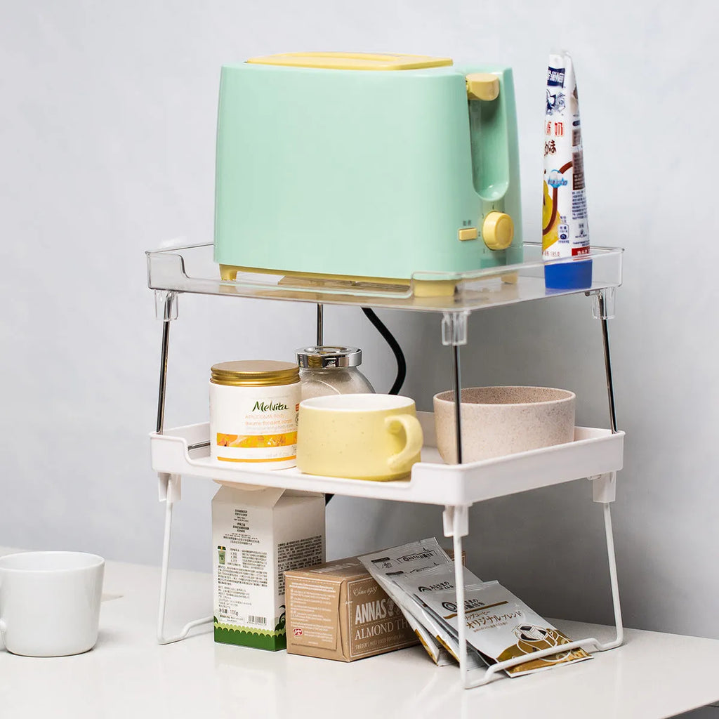 Transparent or white plastic kitchen supplies rack on a countertop or inside a cupboard