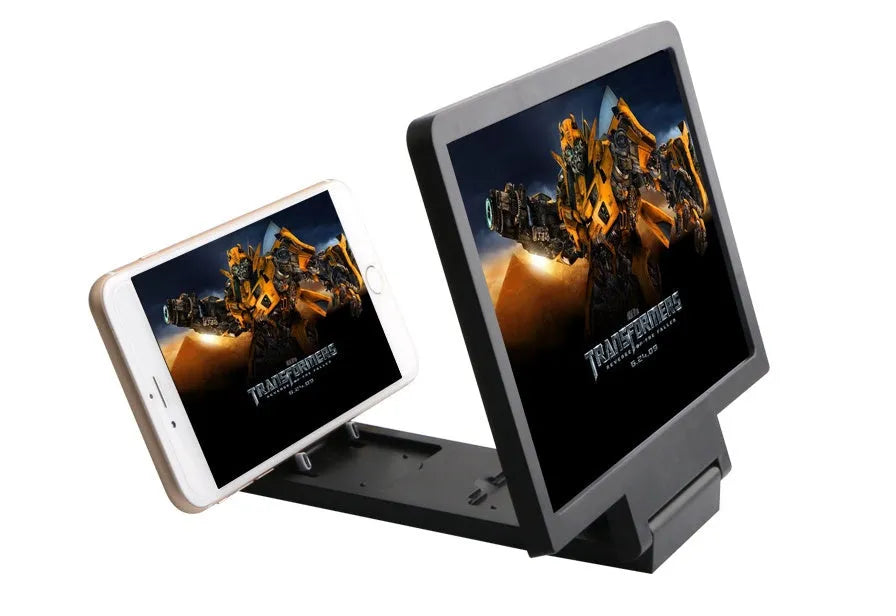 Black or white portable screen amplifier magnifier for mobile phones and laptops on a table.
