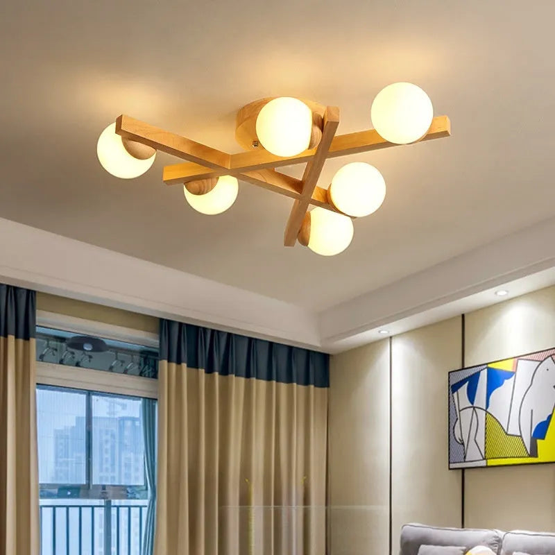Nordic wooden-style ceiling light with three adjustable heads in a modern living room setting.