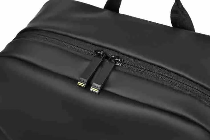 Large black waterproof backpack made from PU leather with sewing thread detailing